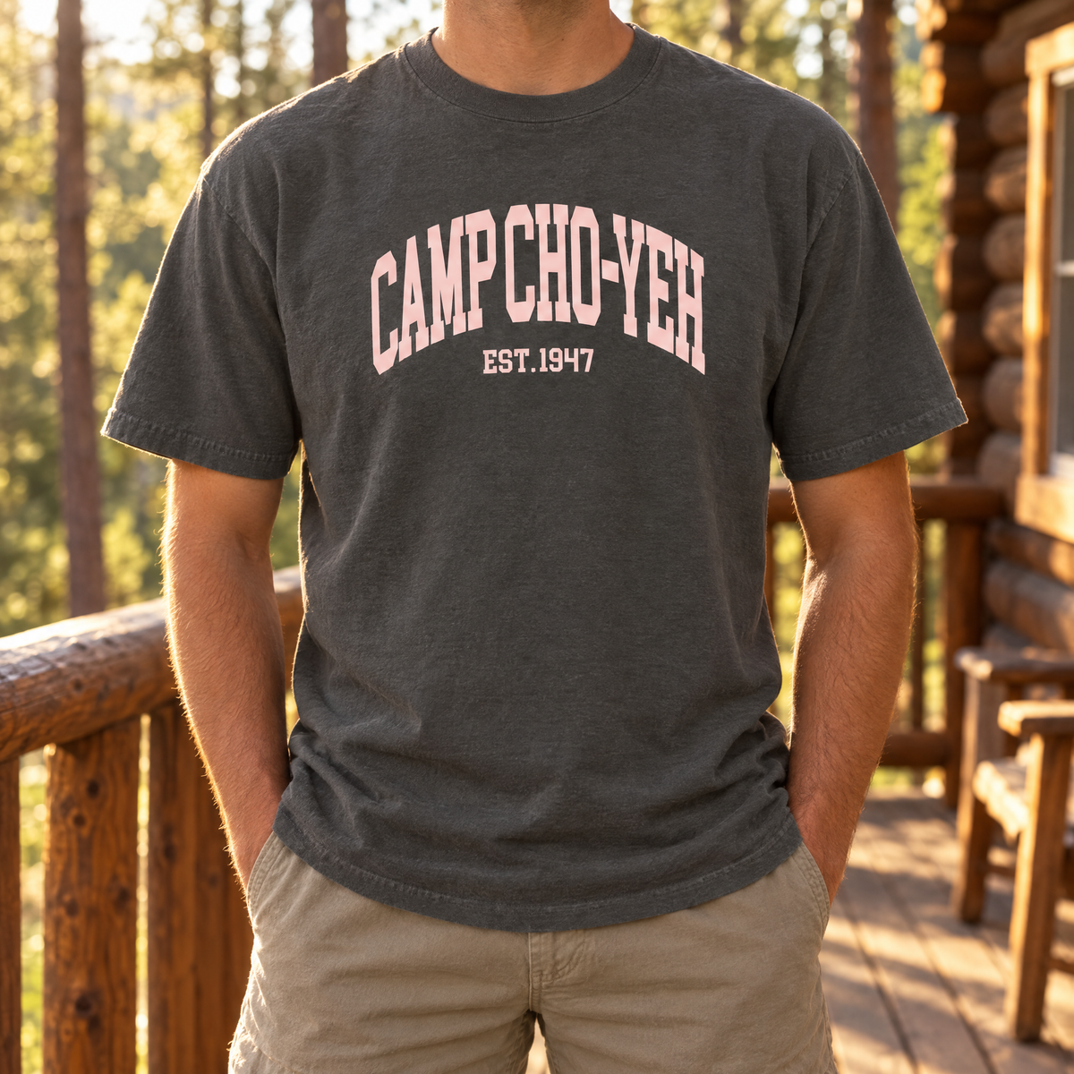 Est. 1947 Tee in Pepper, front print, worn on a cabin porch at Camp Cho-Yeh